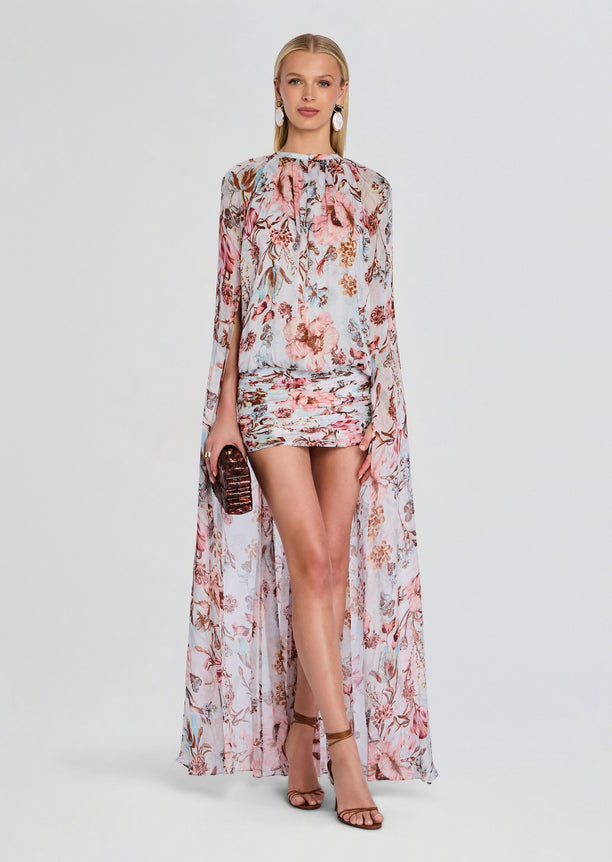 Ezra Ruched Cape Mini Dress in pale blue with pink floral print and cape overlay on a model