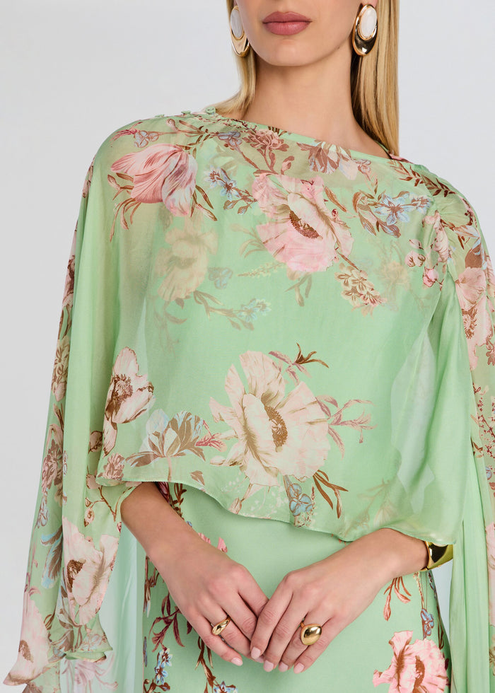 Close up of the mint green floral Ezra Ruched Cape top showing gathered neckline and sheer draped cape media 3 of 5