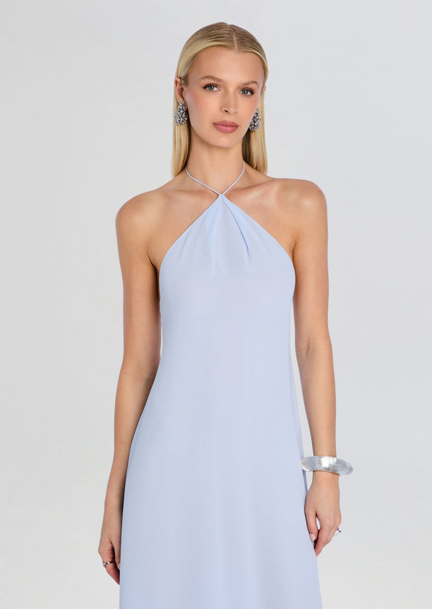 Front view of a model wearing a light blue Sally Maxi Dress with a halter neckline and flowing silhouette