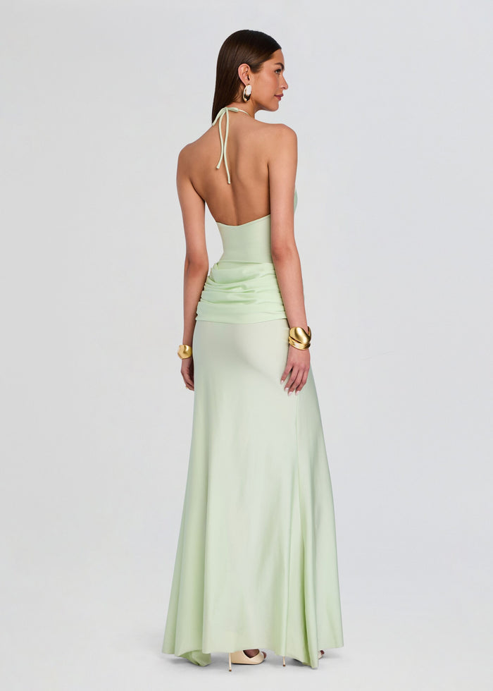 Back view of mint green Valentine Maxi Dress showing halter tie open back and draped ruched waist into a floor length skirt. media 4 of 5