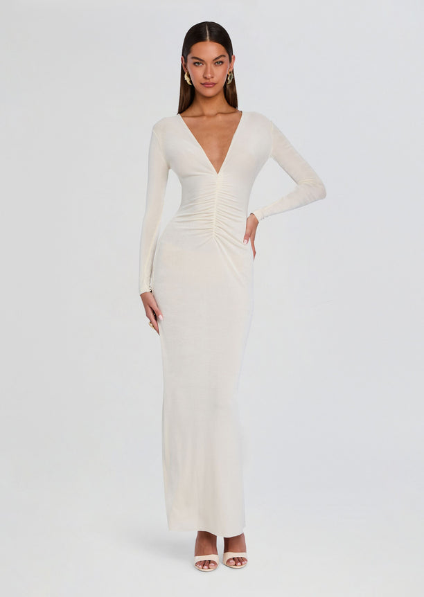 Front view of a cream Ebony Maxi Dress with a plunging V neckline and ruched center on a model.