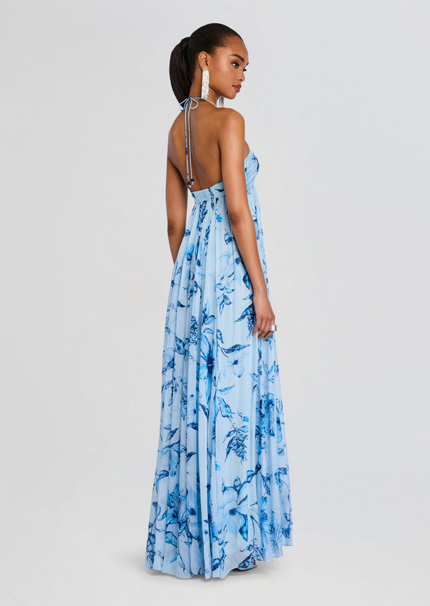 Back view of a light blue floral strapless flared dress with a tie at the back.