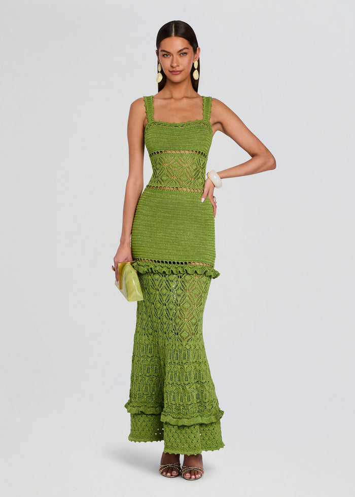 Vibrant green crochet halter dress with fitted top and long scalloped lace skirt worn by a model media 1 of 5
