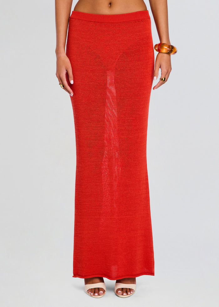 Kora Knit Maxi Skirt in bright red drapes to the floor with a smooth knit texture. media 1 of 5