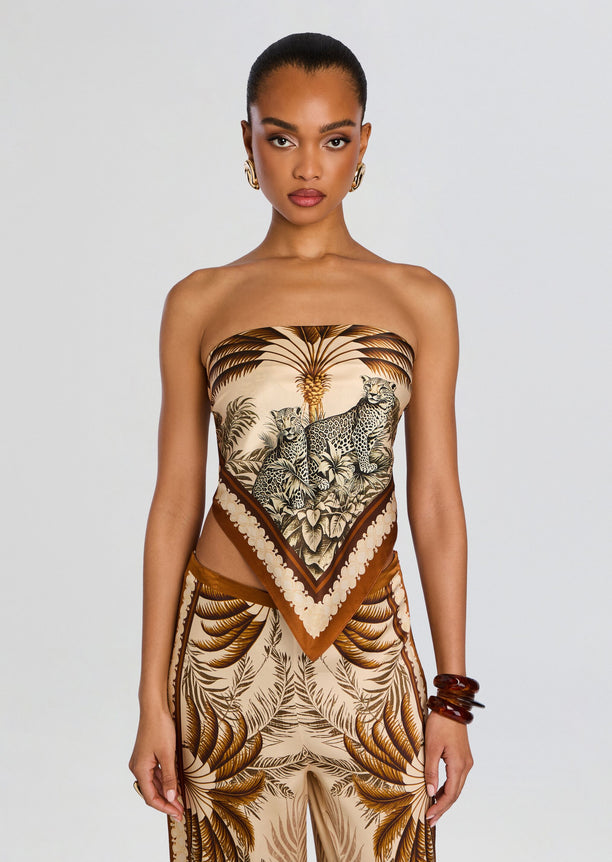 Strapless silk top with tropical jungle print featuring tigers, paired with matching palm leaf print pants.