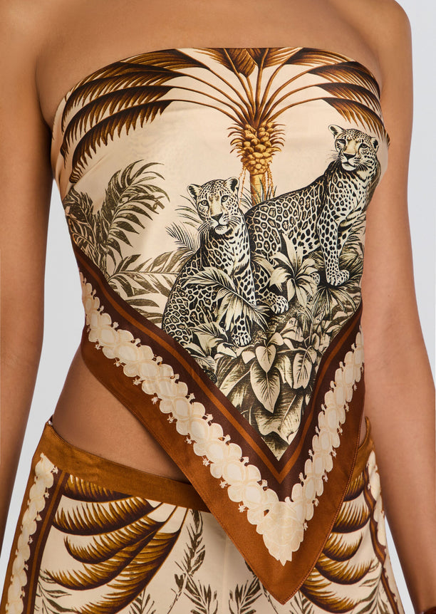 Close-up of the Alivia Silk Top showing palm leaves and a leopard print in beige and brown.