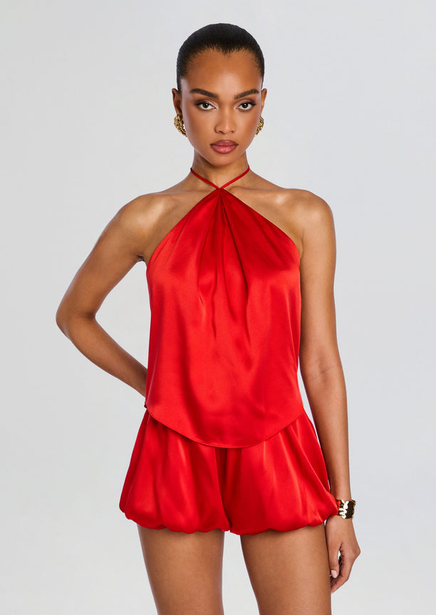 Beckham Tank in bright red satin with halter neckline and draped front on model.
