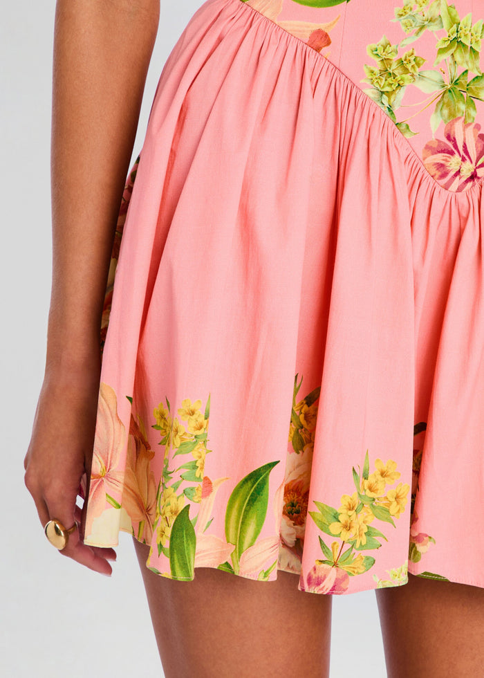 Close-up of the pink skirt with tropical floral border print along the hem. media 2 of 5