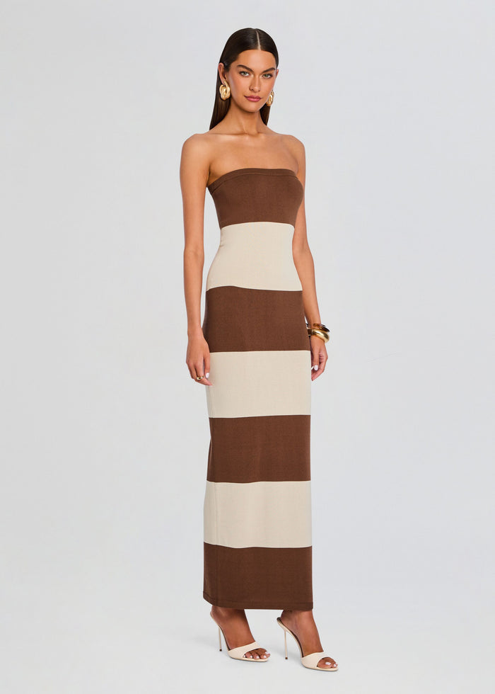 Model wearing Carrie Knit Maxi Dress in brown and beige wide stripes with strapless color block silhouette media 3 of 6