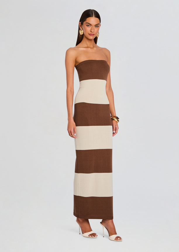 Model wearing Carrie Knit Maxi Dress in brown and beige wide stripes with strapless color block silhouette