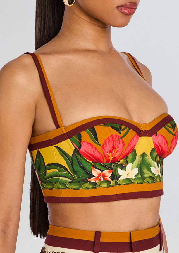 Cricket Bustier Top with tropical floral print, mustard and burgundy trim, and slim shoulder straps.