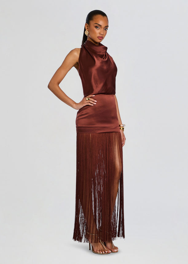 Cyrelle Dress copper satin sleeveless top with a draped neckline and a long fringe skirt viewed from the side