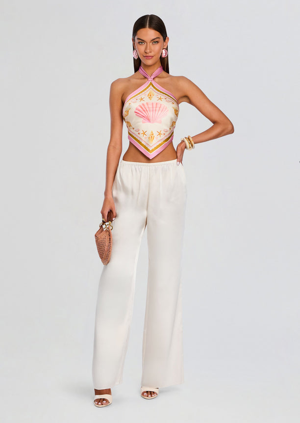 Full length Jamie Silk Top with seashell print pink trim paired with cream wide-leg pants.