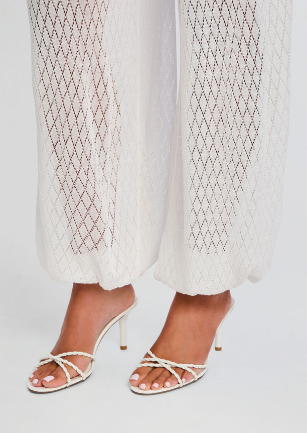 Devyn Pant sheer lattice pants ending at the ankle with white braided sandals