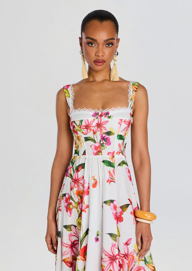 Front view of Maui Long Dress on a model showcasing a tropical floral print and square neckline.