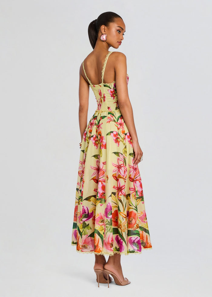 Back view of the Solara Long Dress showing delicate lace straps and a vibrant tropical floral print. media 4 of 5