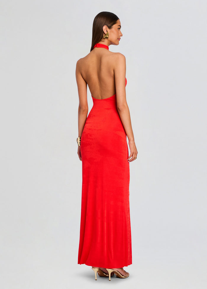 Rear view of the red halter neck maxi dress showing its open back and long skirt media 4 of 5