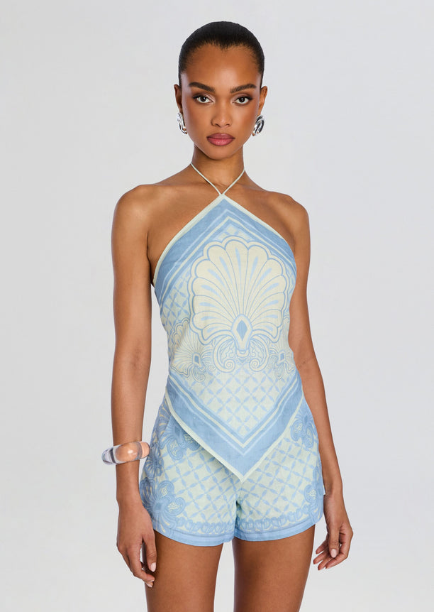 Rosa Top halter neck with pale blue ornate pattern on a model