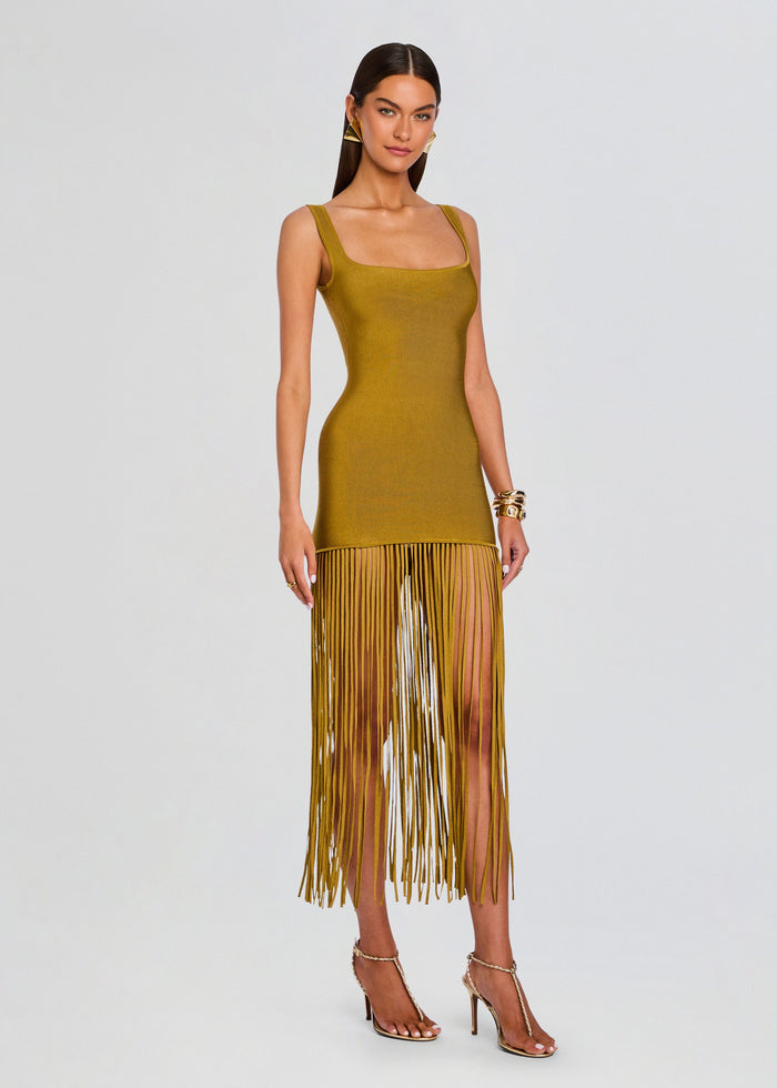Mustard Saddler Dress with thick straps and square neckline, bodycon knit and long fringe hem on a model. media 3 of 5