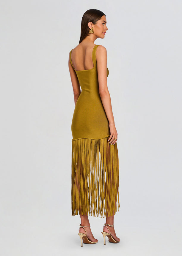 Back view of Saddler Dress in mustard knit with fringe hem and open back neckline.