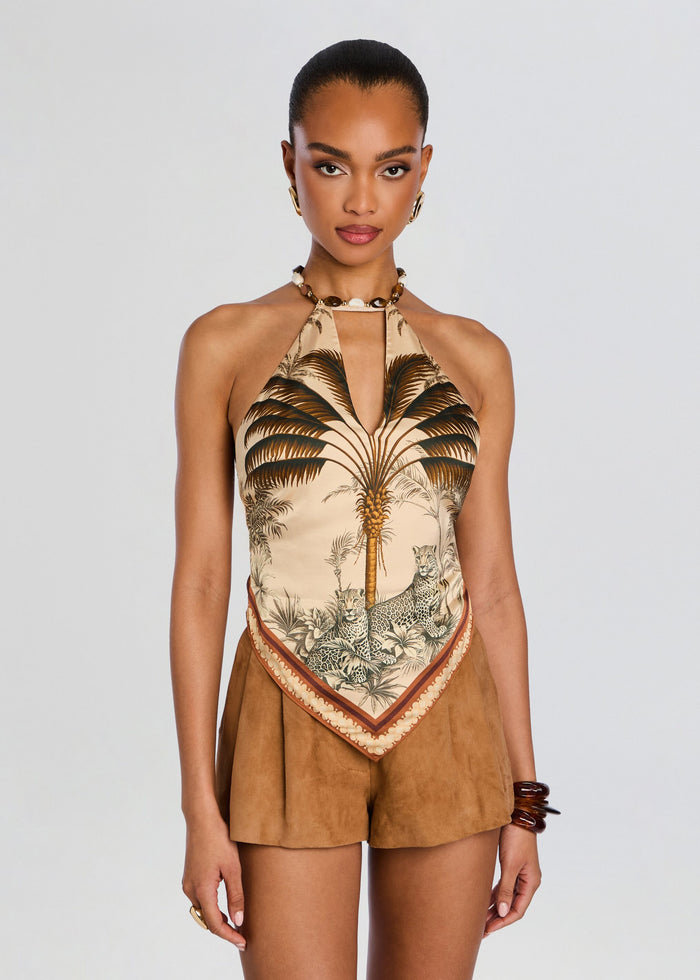 Zaphira Top halter neck with palm tree print worn with tan suede shorts and shell jewelry media 1 of 5