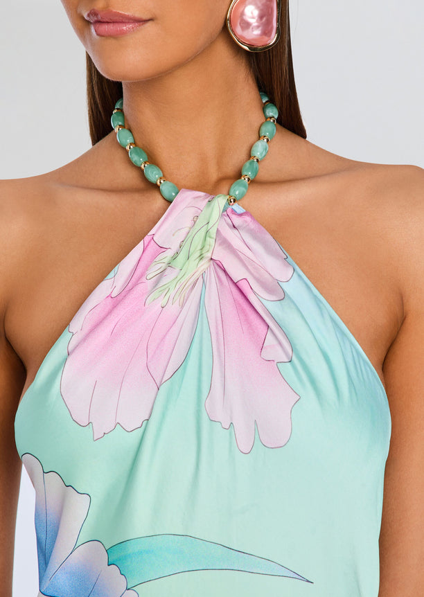 Halter neck Anat Dress close up at the neck with turquoise bead necklace and pink earring