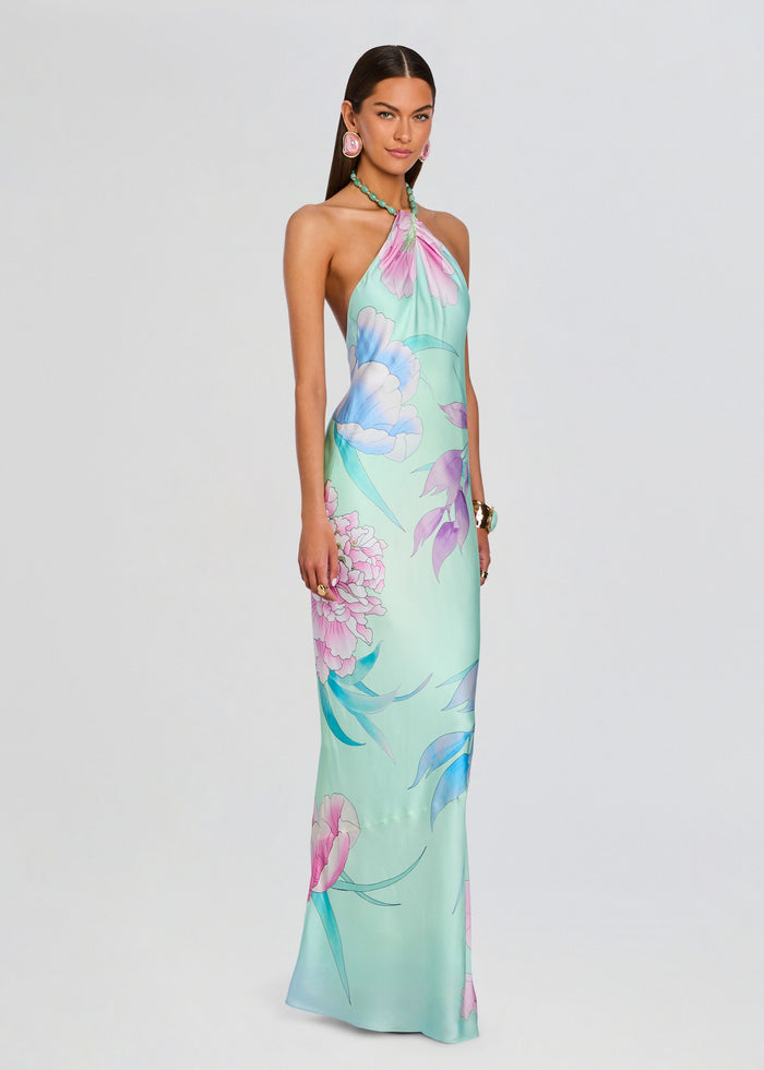 Full-length view of a model wearing the pastel floral Anat Dress with halter neckline media 3 of 5