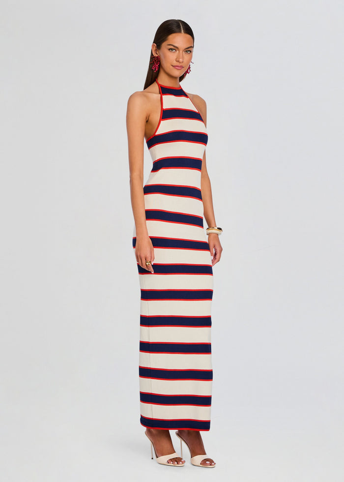 Model wearing Arrabella Knit Maxi Dress with navy red and cream stripes halter neck and full length media 3 of 5