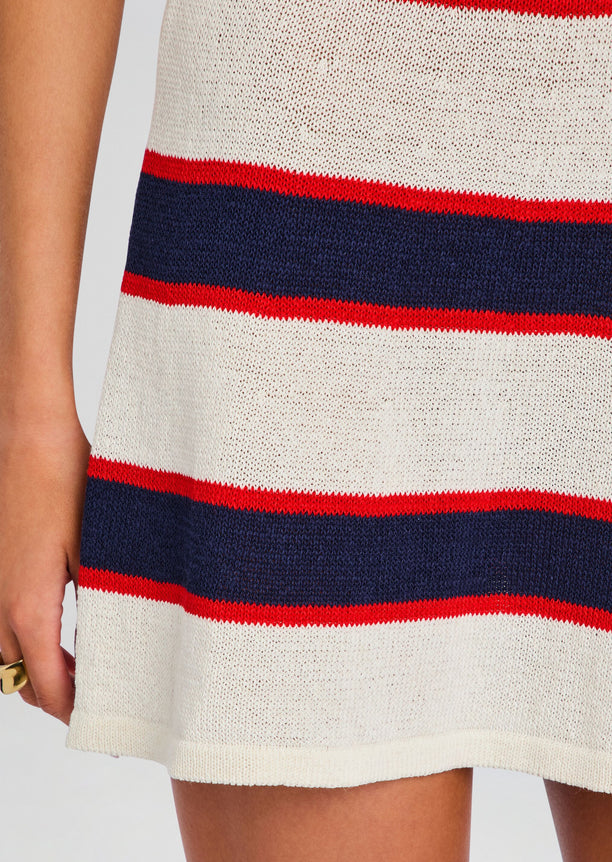 Close-up of cream knit fabric with navy and red stripes from the Azriel Knit Mini Dress