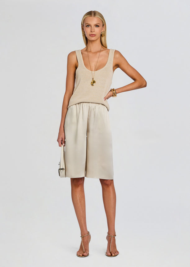 Brice Bermuda Short set with a beige knit tank top and cream satin shorts on a model