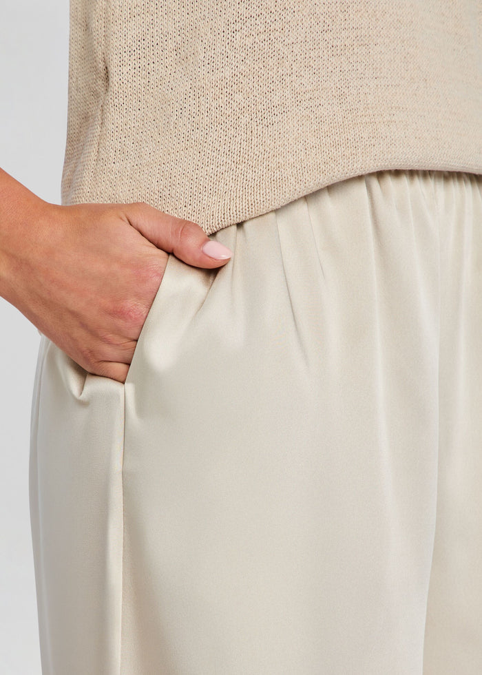 Close up of Brice Bermuda Short waist showing elastic waistband and a hand in the pocket. media 3 of 5