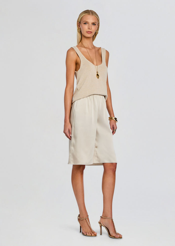 Full model wearing beige Brice Bermuda Short with a matching tank top and gold strappy sandals. media 4 of 5
