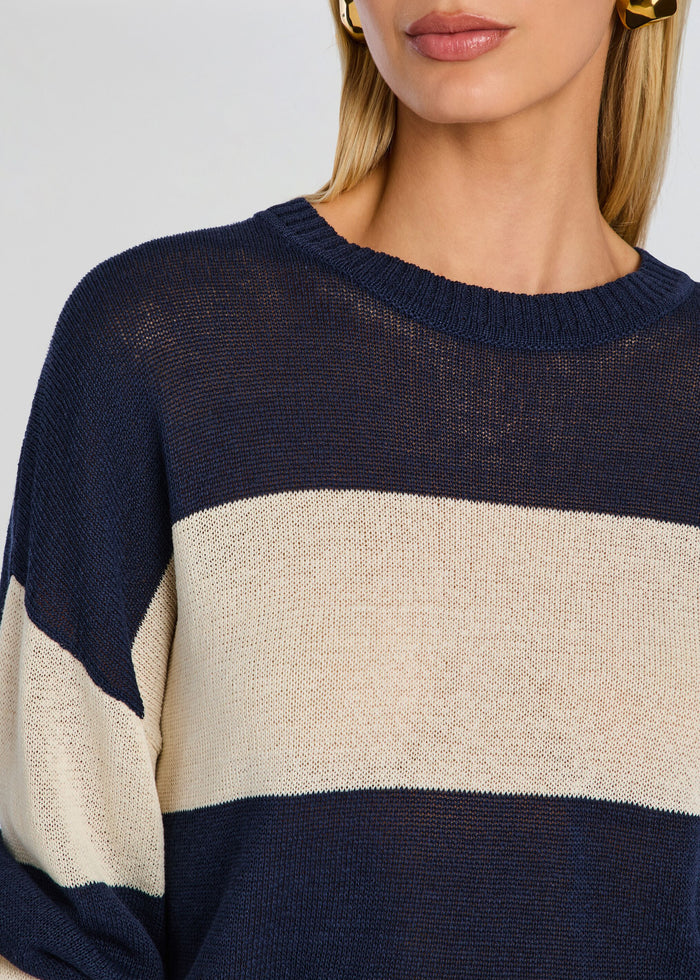 Close-up of the Cassian Sweater showing navy body beige stripe and ribbed crew neck media 3 of 5