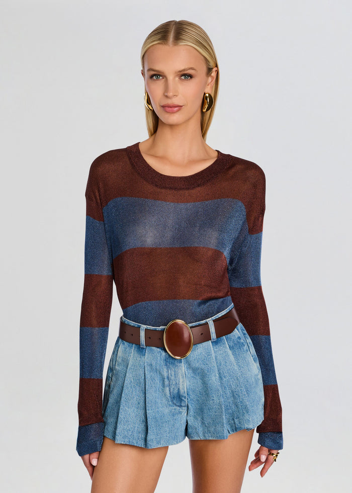 Model wearing Hana Metallic Knit Top with brown and blue stripes, paired with light denim shorts and a brown belt. media 1 of 5
