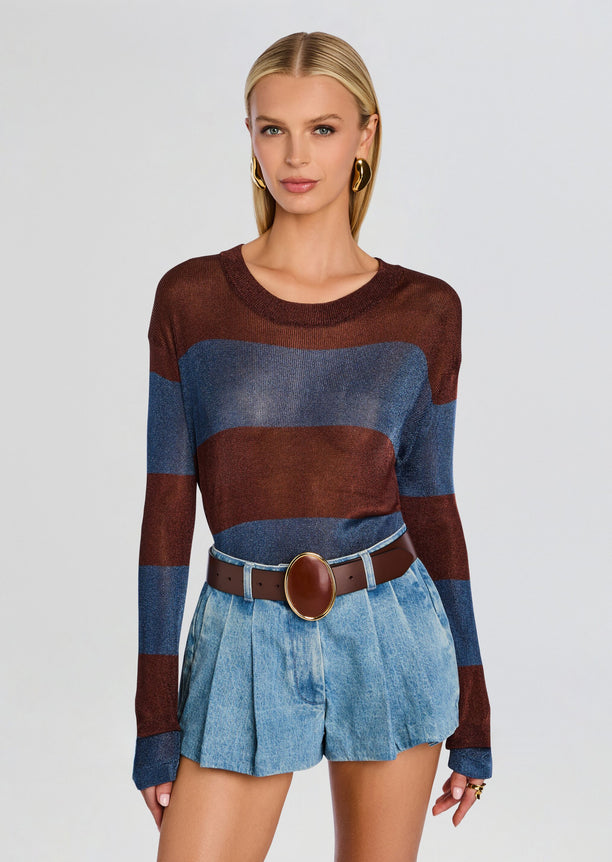 Model wearing Hana Metallic Knit Top with brown and blue stripes, paired with light denim shorts and a brown belt.