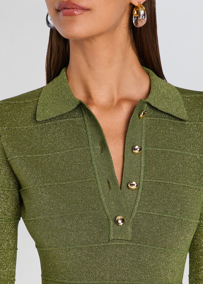 Close-up of a model wearing a textured olive green long-sleeve knit top with a collar and gold-tone buttons on the placket. media 2 of 5