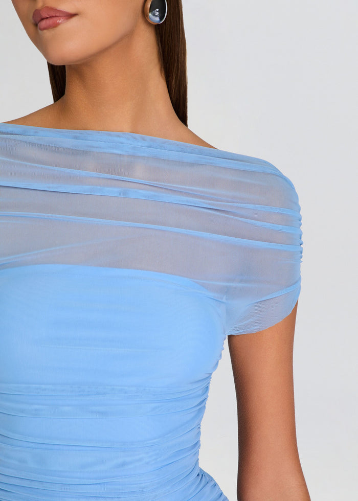 Light blue dress with sheer shoulder detail on a plain background media 2 of 5