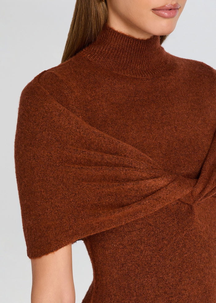 Brown knit poncho dress worn by a person on a light gray background media 2 of 5