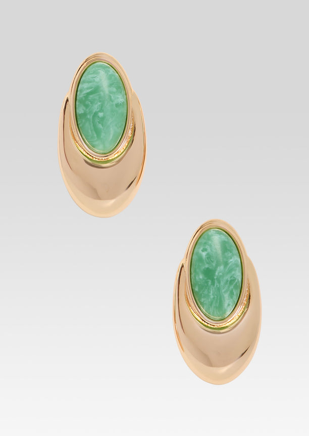 Gold-tone earrings with green oval stone set in a sculptural curved base
