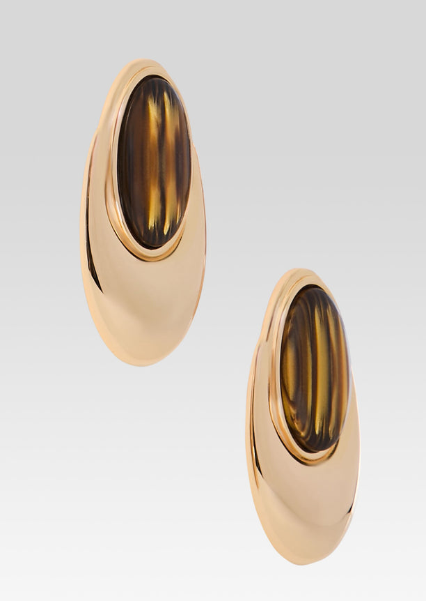 Pair of Blare Earrings in gold with oval tortoiseshell centers, shown from the front.