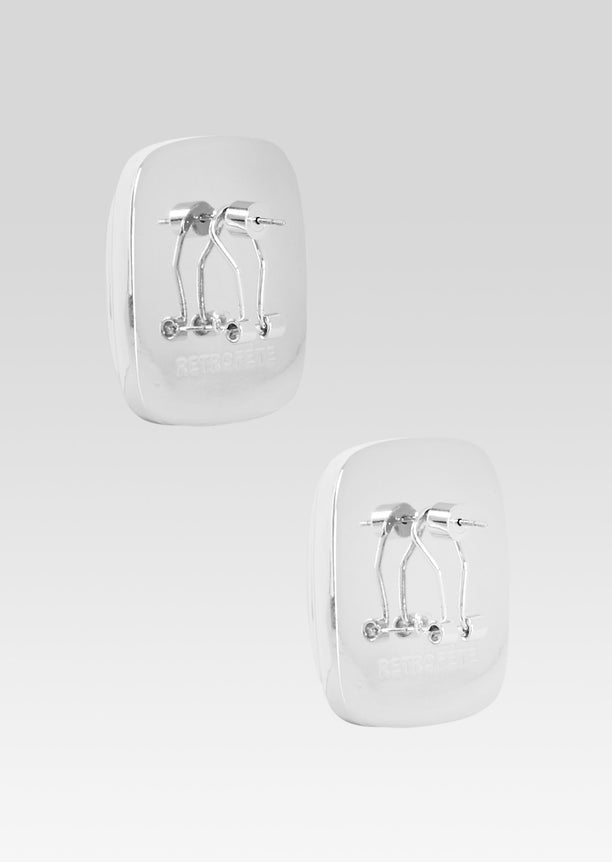 Back and side view of a square crystal stud earring with a reflective silver bezel.