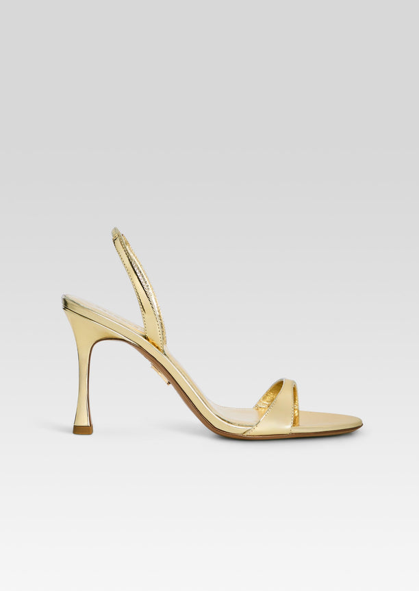 Fortune Sandal gold metallic sandal with narrow toe strap and curved stiletto heel
