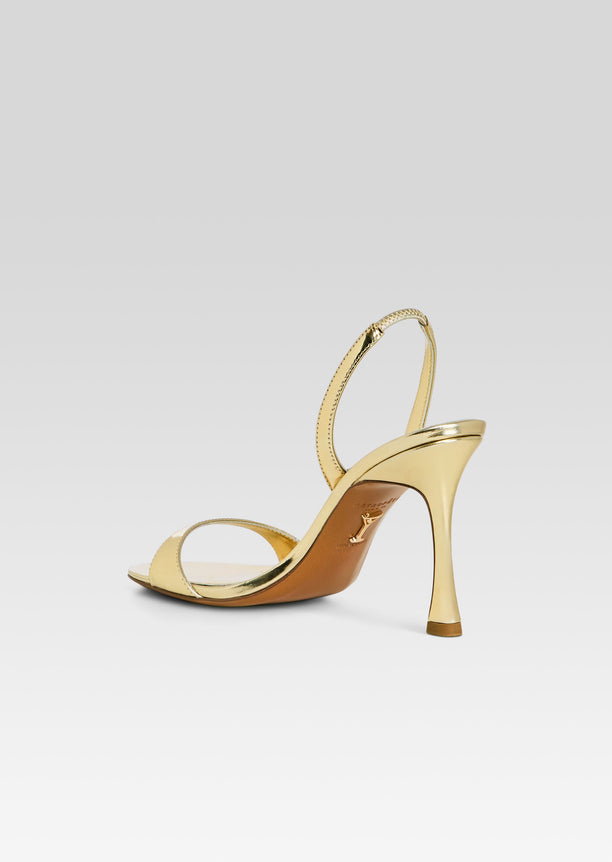 Gold metallic Fortune sandal with slender toe strap and ankle wrap