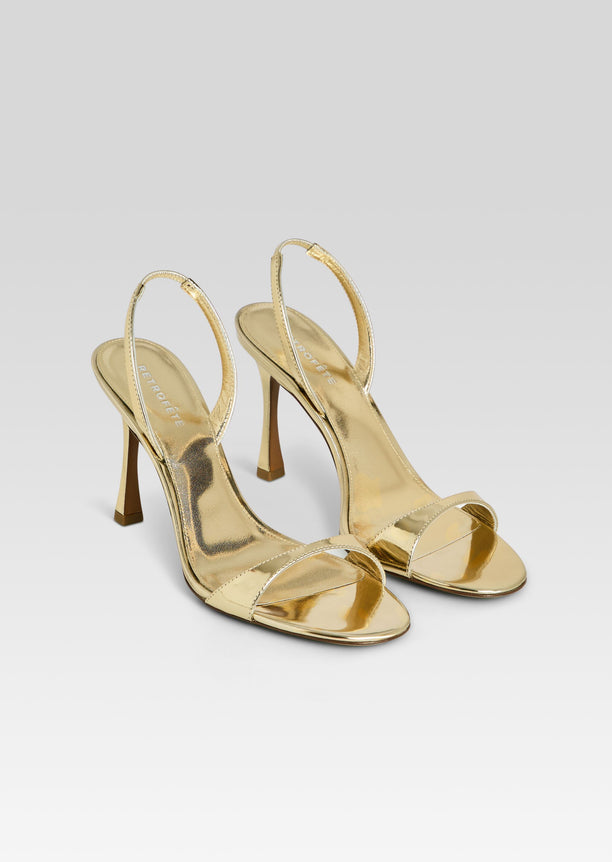 Fortune Sandal in gold metallic with slim ankle strap and stiletto heel