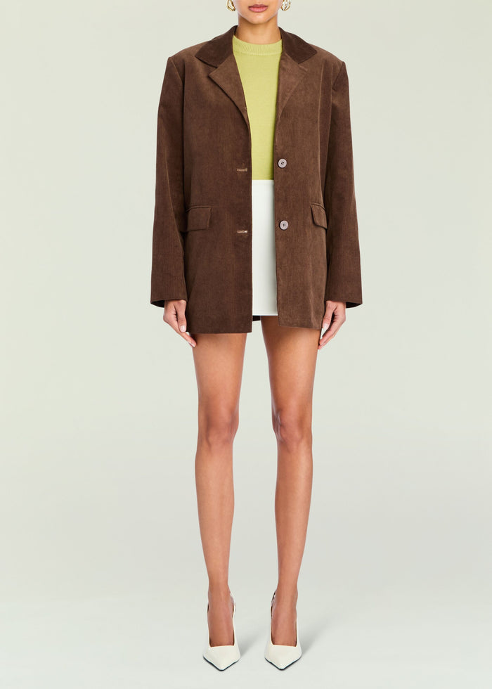 Brown corduroy Hera Blazer worn open over a lime knit top and white bottom on a full length model media 5 of 5