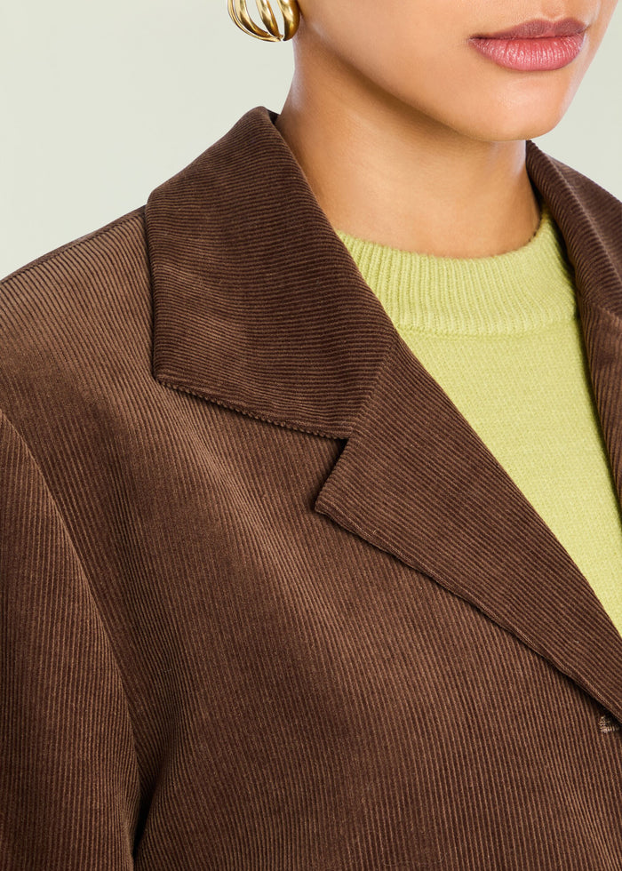 Hera Blazer close-up showing brown corduroy fabric and wide lapel with lime knit underneath media 2 of 5