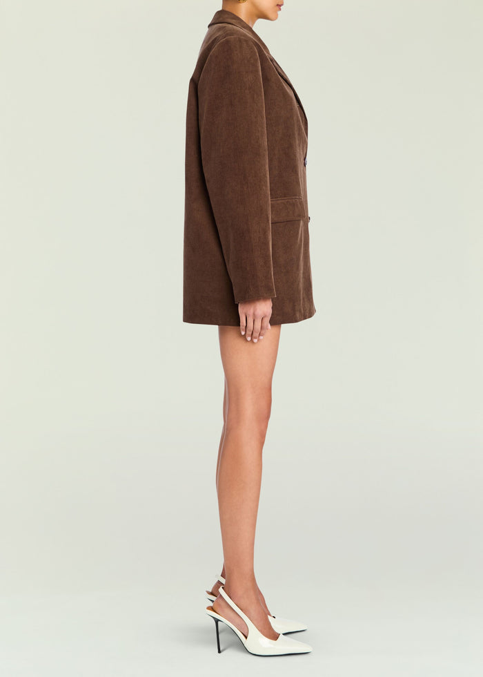 Side view of model wearing brown corduroy Hera Blazer over lime knit top with white slingback heels media 3 of 5