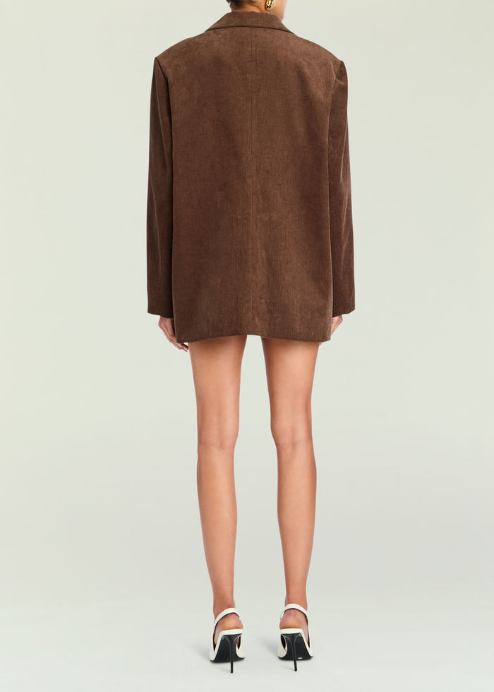Back view of Hera Blazer in brown corduroy reaching mid thigh on the model media 4 of 5