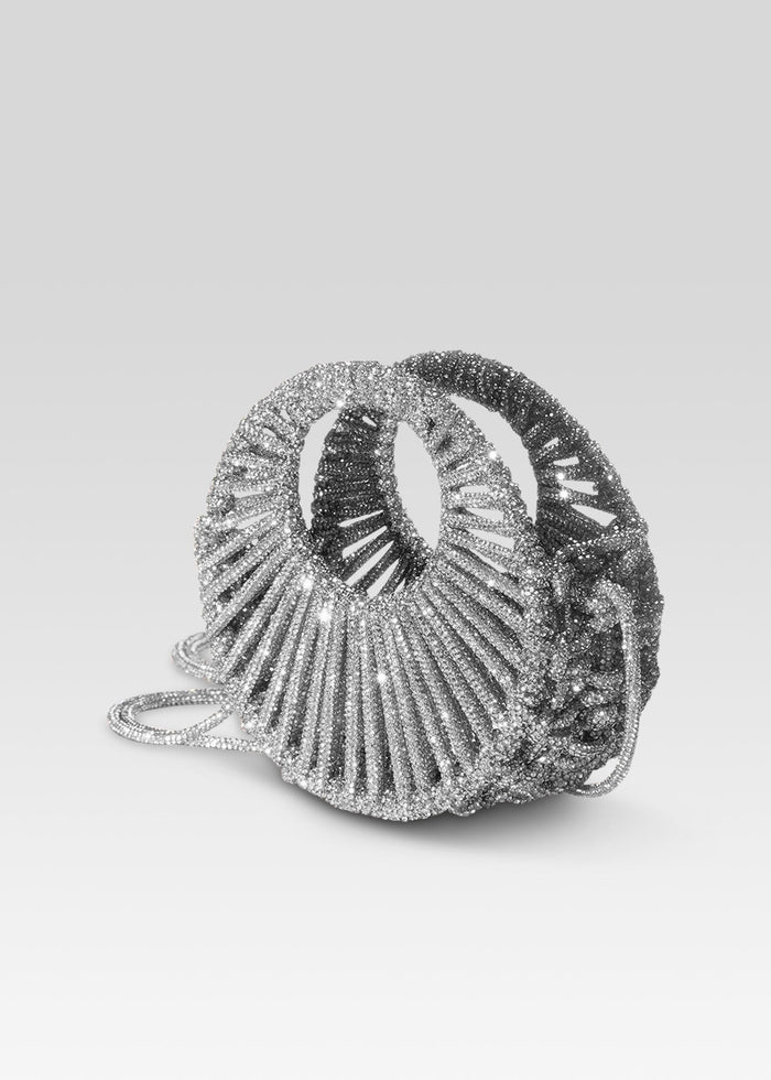 Jaya Mini Bag in a silver beaded circular design with radiating spokes and a detachable chain strap on a gray background. media 3 of 3
