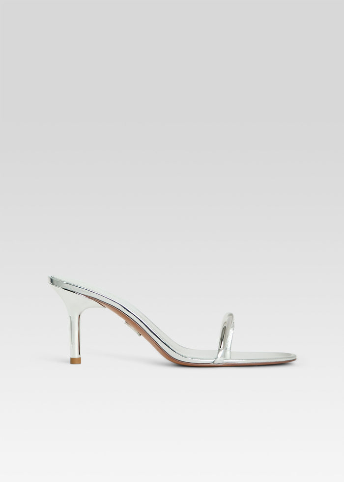 Silver metallic Karli sandal with a slim strap and curved mid heel in profile media 1 of 5